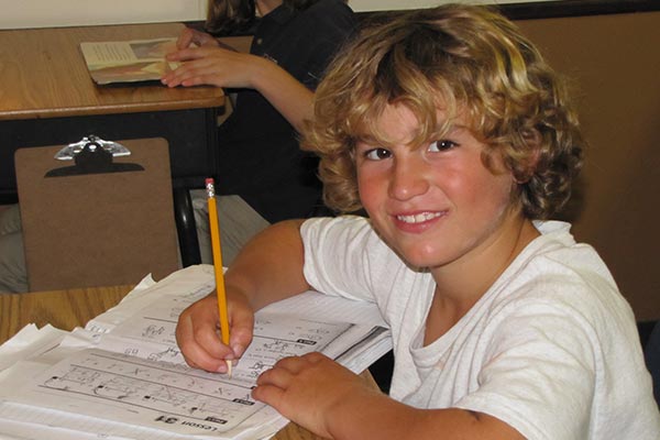 Student Working in Local Private School Near Home